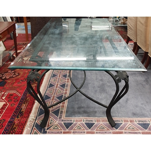 918 - A large Metal Table with bevelled glass top. 105 x 200 x H 77 cm approx.