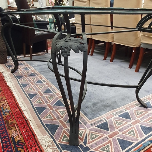 918 - A large Metal Table with bevelled glass top. 105 x 200 x H 77 cm approx.