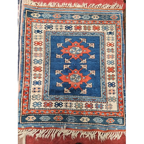 916 - A good Persian cream and blue ground Rug with multi borders and unique central medallion design. 130... 