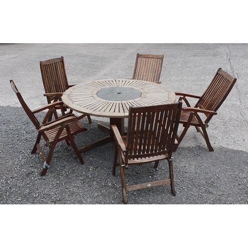 951 - A Circular Garden Table with Granite Lazy Susan center piece along with 6 fold up timber Chairs with... 