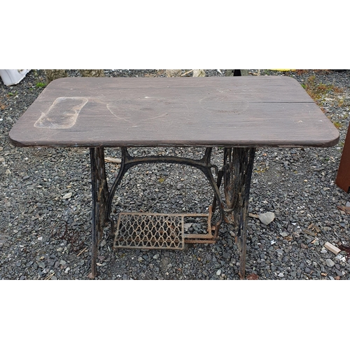 963 - A Cast Iron Sewing table base converted to a Table along with a Robe Ladder.