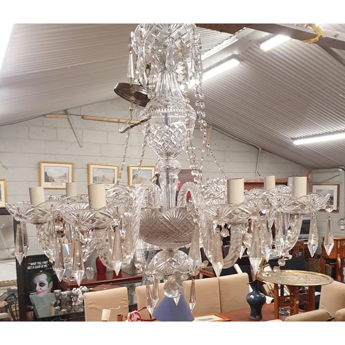 890 - A large Crystal eight branch Chandelier with crystal drops. Drop 70 x W 65 cm approx.