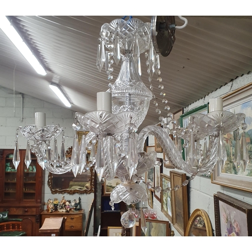 902 - A good Crystal five branch Chandelier. Drop 55 x w 52 cm approx.