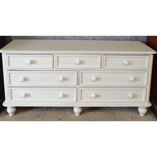 974 - A white painted Pine Low Chest of Drawers.
H 73 x 153 x 47 cm approx.