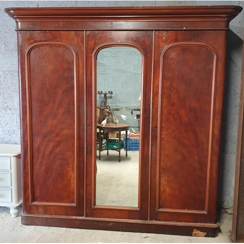 975 - A Large 19th Century Mahogany and Veneer 3 Door Wardrobe with fitted interior.
H 215 x 220 x 70 cm a... 