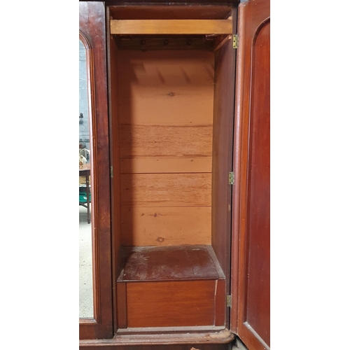 975 - A Large 19th Century Mahogany and Veneer 3 Door Wardrobe with fitted interior.
H 215 x 220 x 70 cm a... 