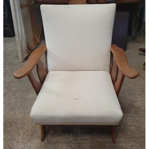 1020 - An Early 20th Century Arm Chair with white upholstery .