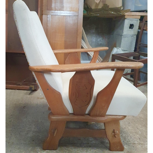 1020 - An Early 20th Century Arm Chair with white upholstery .