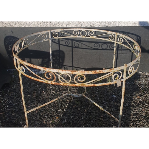 27 - Sold on behalf of Charity. A large Metal circular Table with pierced outline, lacking top. H 74 x D ... 
