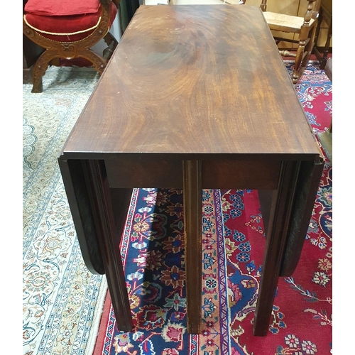 59 - A Georgian Mahogany dropleaf Table on square fluted supports. W 112 x 153 x H 71 cm approx.