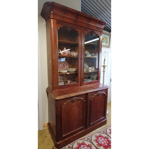 90 - A Fantastic 19th Century Mahogany two door Bookcase with carved twin panel base and glazed upper and... 