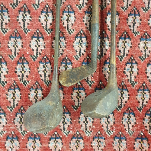 99 - A good quantity of Vintage Golf Clubs.