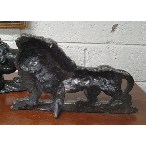 116 - A good pair of Cast Iron Doorstops depicting lions. L 22 x H 14 cm approx.