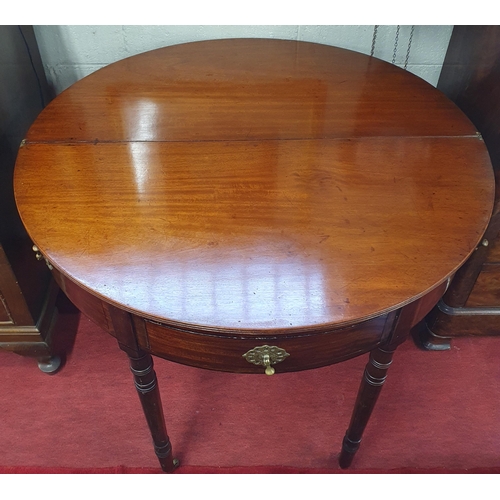 136 - A good 19th Century Mahogany halfmoon foldover Tea Table with single frieze drawer on turned support... 