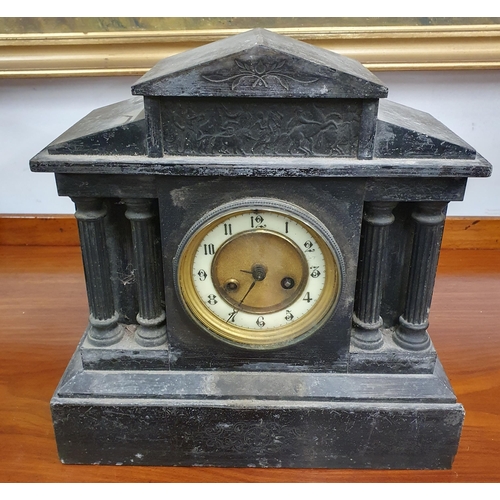 140 - A black Slate Mantel Clock with columned pillar outline. 31 x 13 x H 31 cm approx.