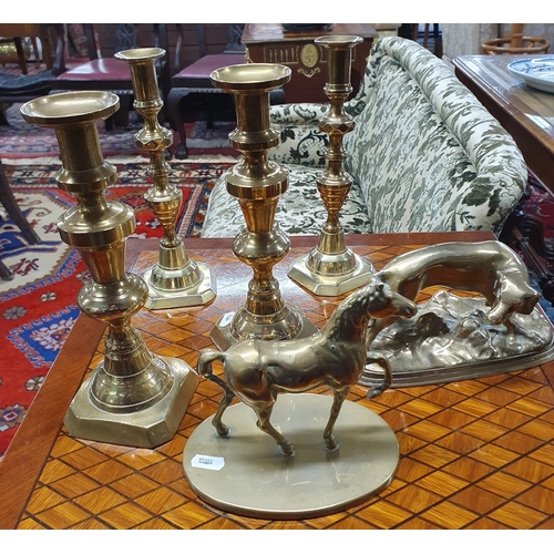 141 - A good quantity of Brassware to include two pairs of 19th Century candlesticks, a heavy figure of a ... 