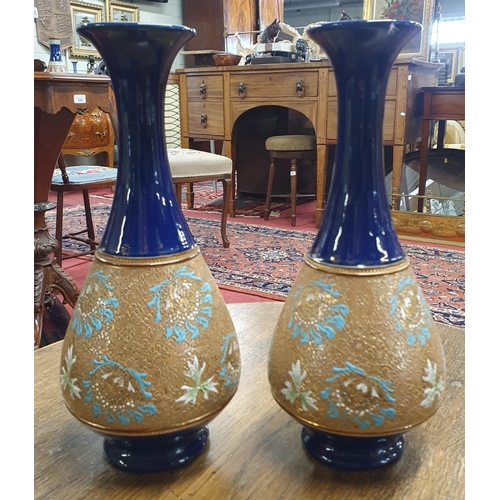 146 - A good pair of Royal Doulton salt glaze blue ground Vases. H 27 cm approx.