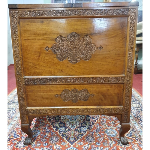 168 - A good Rosewood Drinks Cabinet with fitted interior and highly carved outline. 61 x 43 x H 77 cm app... 