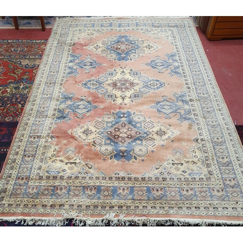 211 - A pink ground Carpet with multi borders and unique central medallion design. 285 x 193 cm approx.