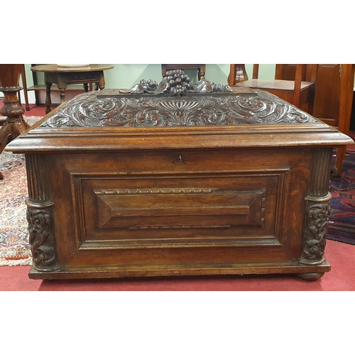 241 - A Superb early to mid 19th Century Irish Oak Cellerette with highly carved sarcophagus shaped outlin... 