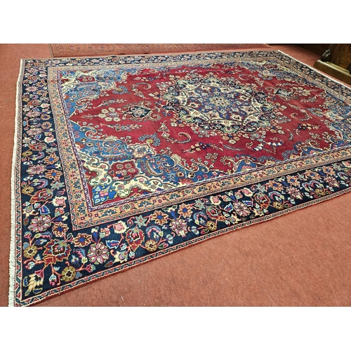 445 - A rich Red and Blue ground Persian Najah Bad Carpet from the Isfahan region of Iran. 370 x 270 cm ap... 