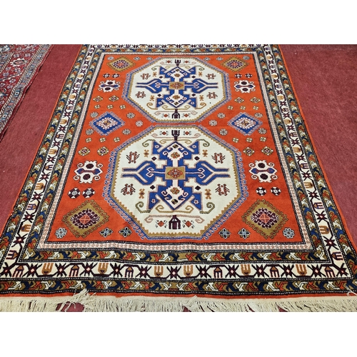 449 - A good Kazak cream ground Carpet with multi borders and central medallion design, 308cm x 254cm appr... 