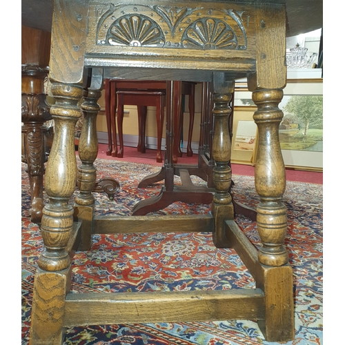 463 - A late 19th Century Oak Provincial circular Table on turned supports and stretcher base. D 56 x H 48... 