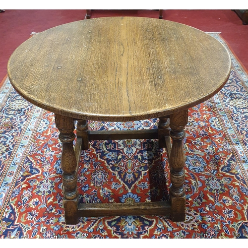 463 - A late 19th Century Oak Provincial circular Table on turned supports and stretcher base. D 56 x H 48... 