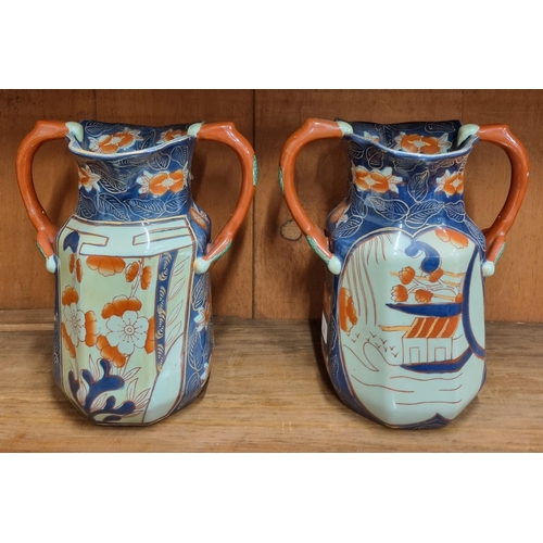 479 - A pair of Oriental style Stoneware twin handled Vases. H 28 cm approx.