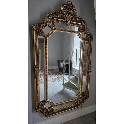 494 - An extremely large Timber and Plaster Gilt Overmantel Mirror with highly pierced cartouche top and s... 