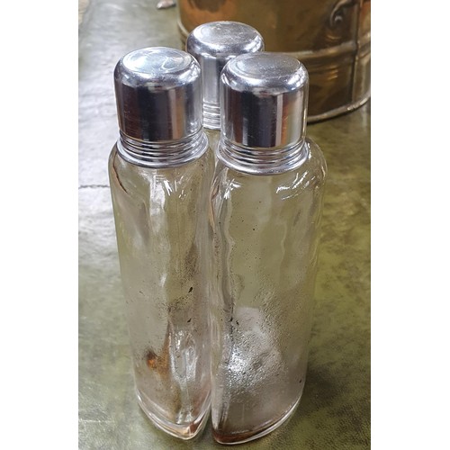 531 - A cased Vintage liquor set consisting of three shaped bottles with silver plated screw tops and shot... 