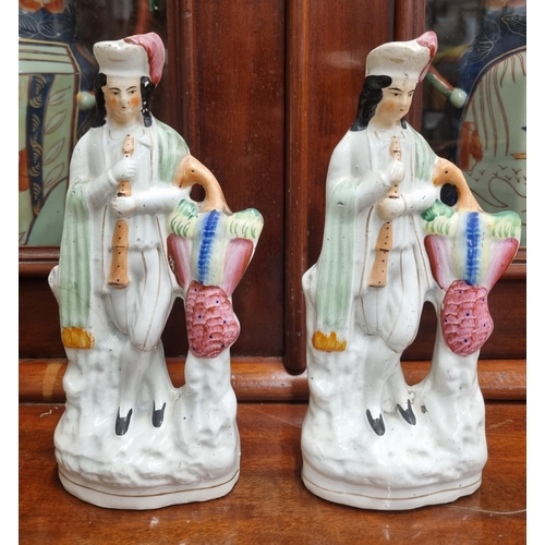 532 - A pair of 19th Century Staffordshire flat back Figures. H 26 cm approx.