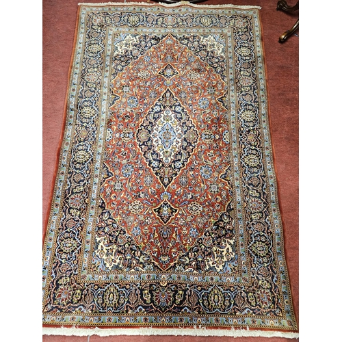 539 - A good red and blue ground Persian Rug with multi borders and unique central medallion design 226cm ... 