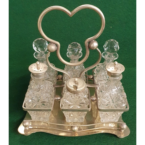 540 - A 19th Century Silver plated Cruet set consisting of six Crystal Bottles in a plated holder.