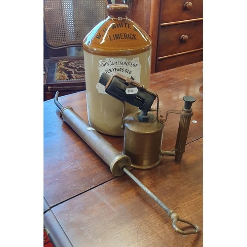 185 - A W H White and Son of Limerick half Flagon with a John Jameson Label along with a brass Burner, vin... 