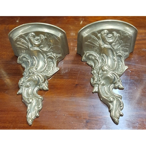 208 - A nice pair of heavy Brass wall Brackets with a highly moulded outline. W 12 x H 18 cm approx.