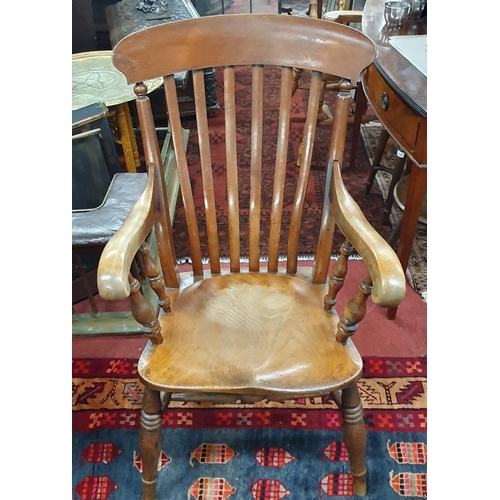 257 - A 19th Century Ash Windsor Armchair of superb quality. W 66 x SH 47 x BH 114 cm approx.