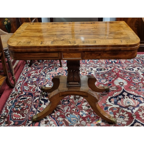 483 - A fantastic Regency Mahogany fold over Card Table on quatrefoil pedestal base and brass castors, rec... 