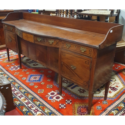 450 - A good Georgian Mahogany and inlaid bow fronted Sideboard with Ebony Greek key detail on square tape... 