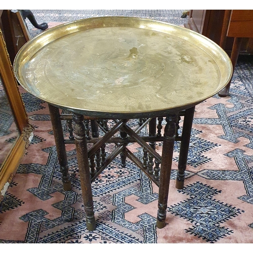 456 - A 20th Century Brass tray top Table with timber base. D 56 x H 56 cm approx.