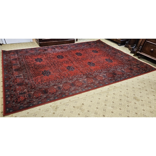 188 - A large Red ground Carpet with repeating central medallion design and multi borders. 349 x 242 cm ap... 