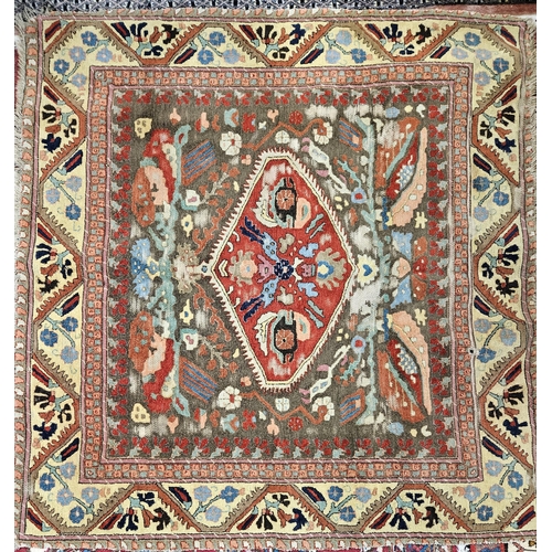 223 - A well worn Persian Rug with central medallion design and multi borders. 127 x 130 cm approx.