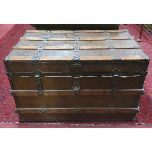 709 - A 19th Century trunk with timber and metal banding. W 91 x 53 x H 57 cm approx.