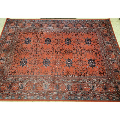 188 - A large Red ground Carpet with repeating central medallion design and multi borders. 349 x 242 cm ap... 