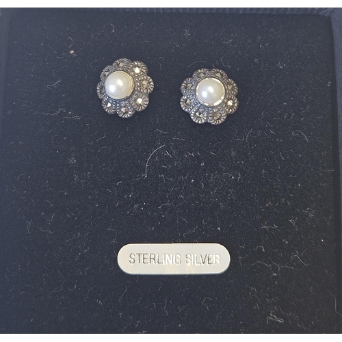 621 - A pair of Silver, Marcasite and Pearl Earrings.