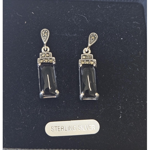 622 - A pair of Silver, Marcasite and Onyx Earrings.