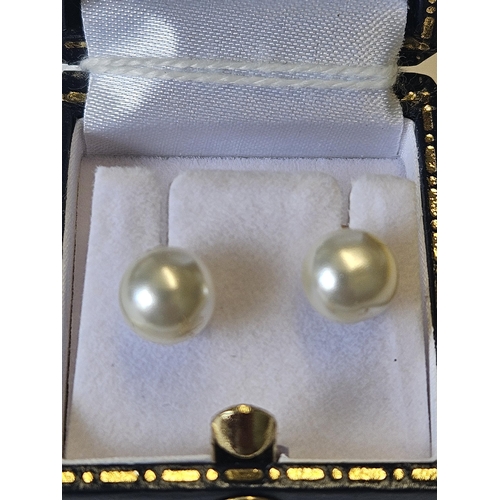 630 - A pair of 9ct Gold and Pearl Earrings.