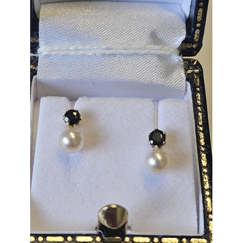 634 - A pair of 9ct Gold, Pearl and Sapphire Earrings.