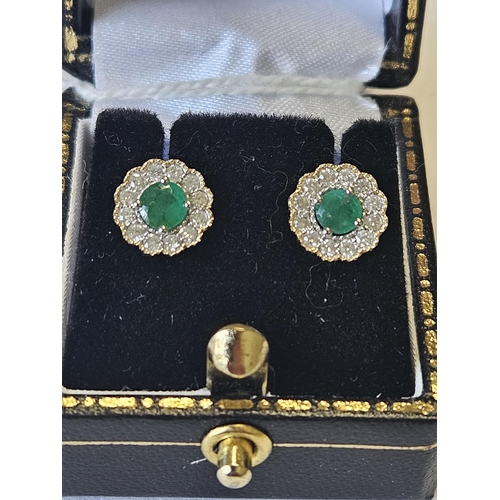 636 - A pair of 9ct Gold, Diamond and Emerald cluster Earrings.