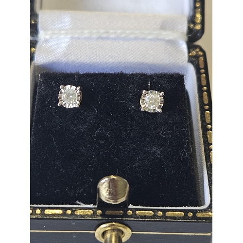 639 - A pair of 9ct Gold and Diamond stud Earrings.